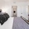 a bedroom with a bed and a table