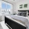a bedroom with a large window