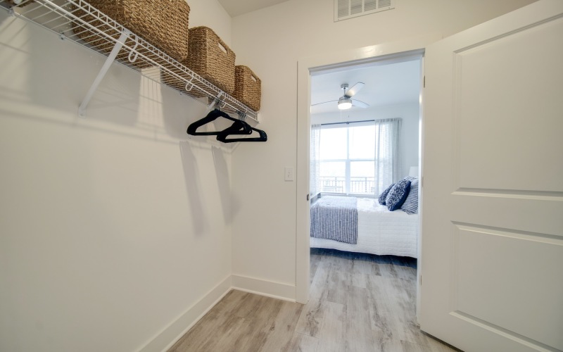 walk-closet with white walls and shelves