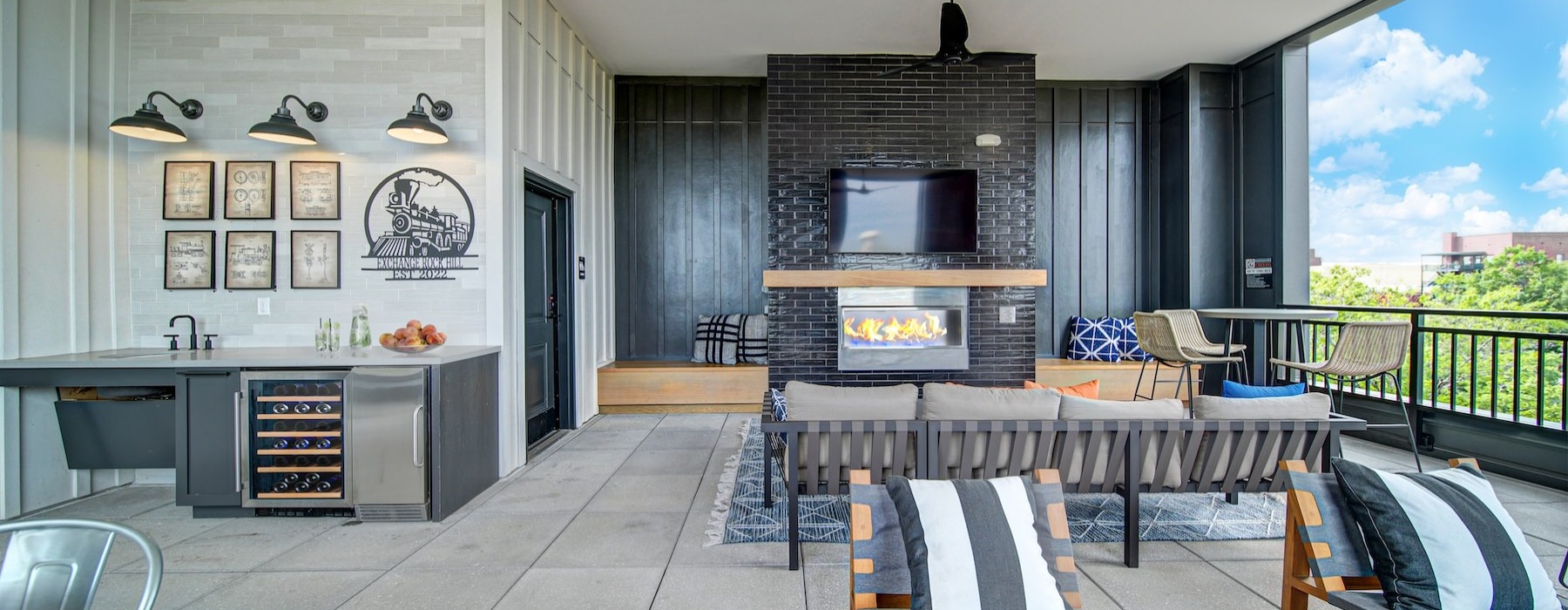 Rooftop terrace with chairs and fireplace