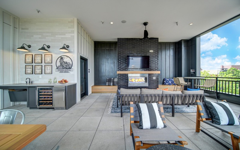 Rooftop terrace with chairs and fireplace