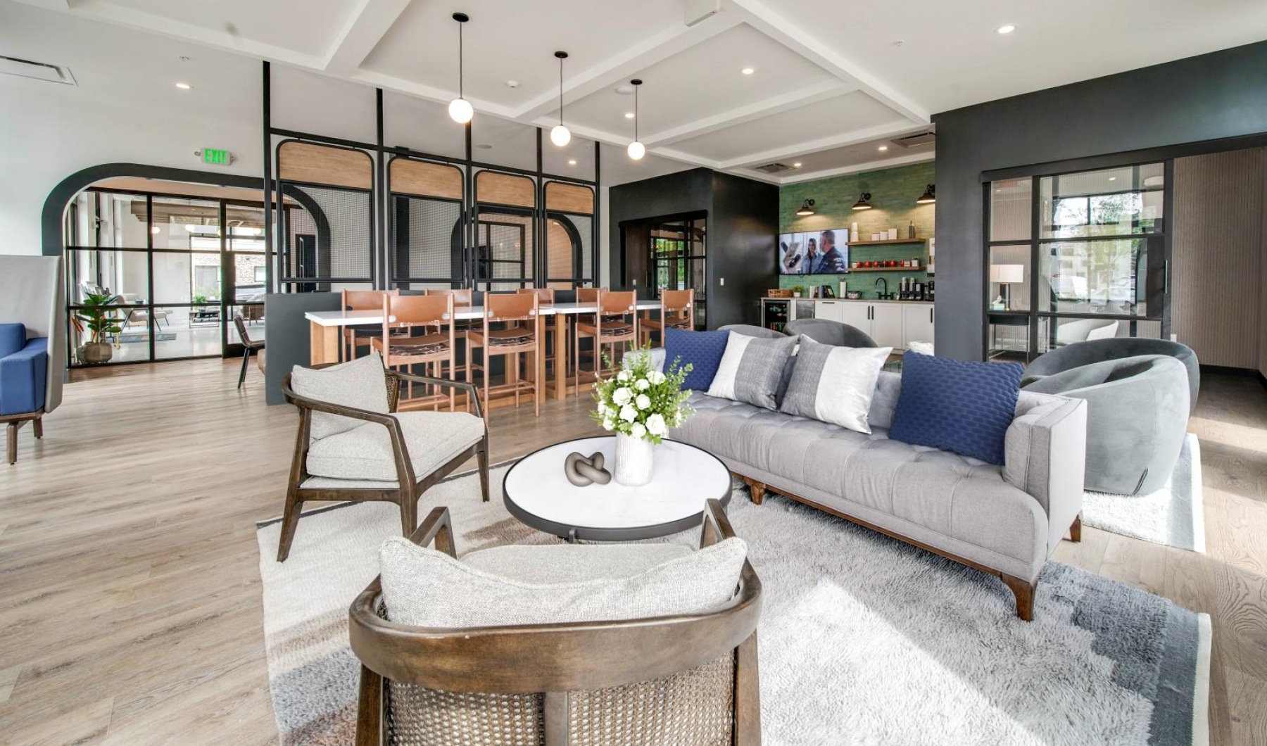 Find your perfect fit at Exchange at Rock Hill Apartments a large room with a couch and chairs