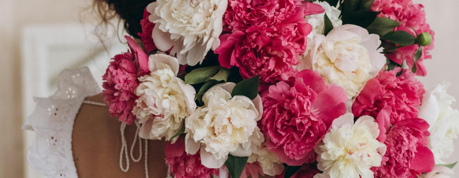 a person holding a bouquet of flowers