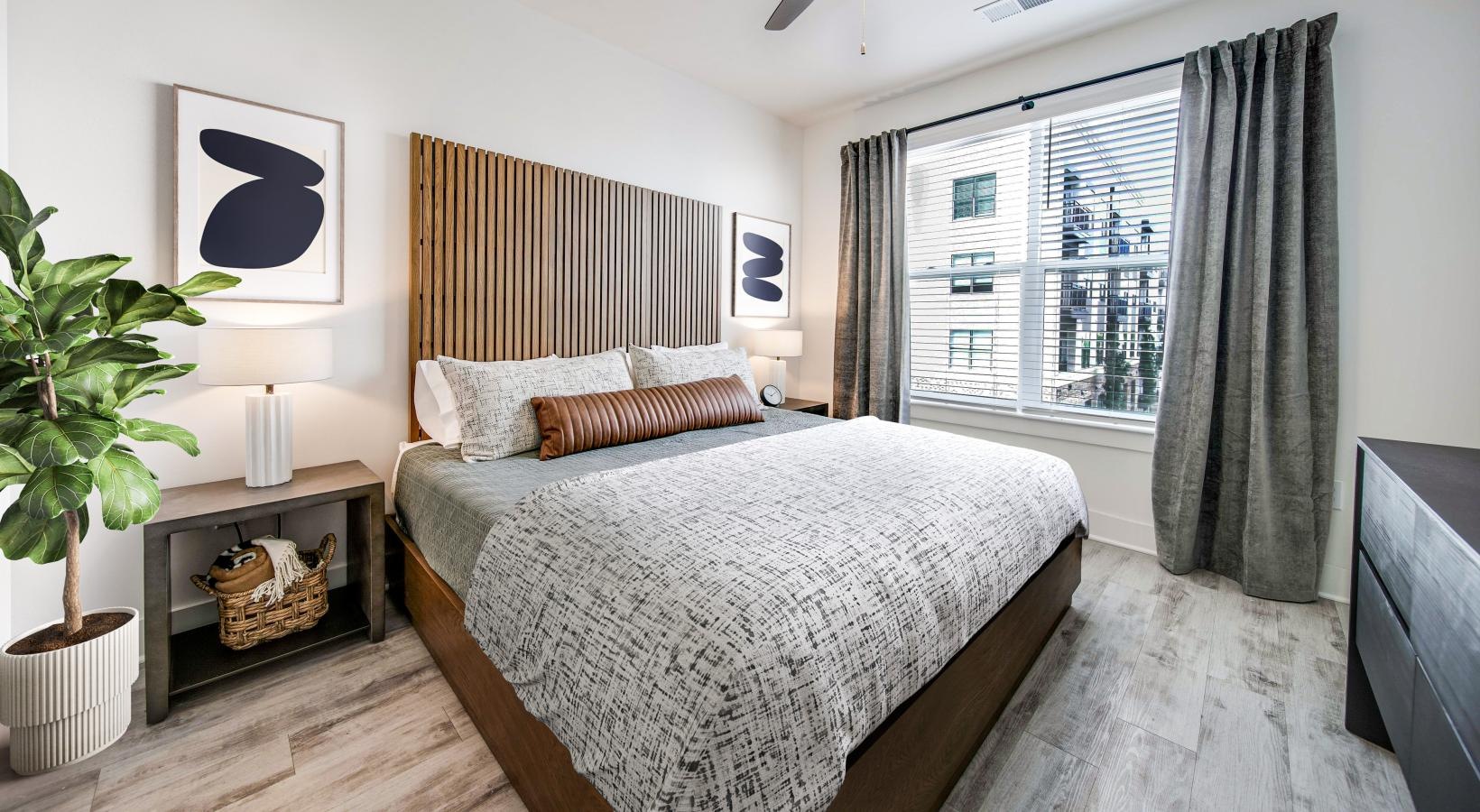 Bedroom options to fit every lifestyle a bedroom with a bed and a plant
