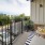 a balcony with a table and chairs